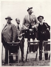 Repro Photo Sir Harry Syanding On Chair With Group Undated